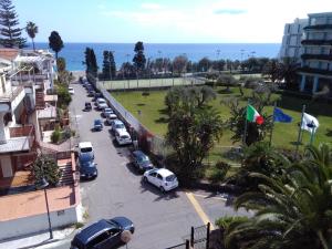 a view of a street with cars parked in a parking lot at Holiday Home Recanati in Giardini Naxos