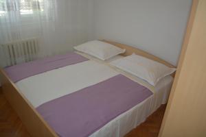 Posteľ alebo postele v izbe v ubytovaní Marin Apartment