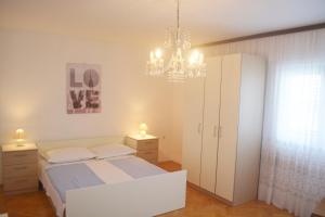 Posteľ alebo postele v izbe v ubytovaní Marin Apartment