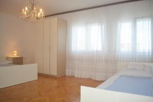 Posteľ alebo postele v izbe v ubytovaní Marin Apartment