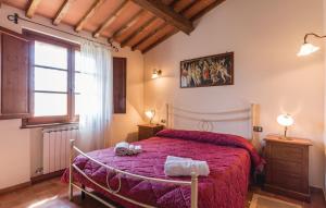 a bedroom with a large bed with a red blanket at Borgo Nuovo San Martino in Ambra +114 photos