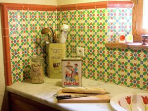 a kitchen counter with a can of cocacola on it at Cottage in Alájar near Gruta de las Maravillas in Alájar +32 photos