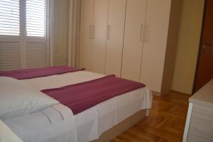 Posteľ alebo postele v izbe v ubytovaní Marin Apartment