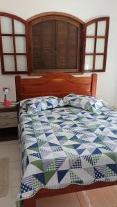 En eller flere senge i et værelse på Casa Saquarema + 13 billeder