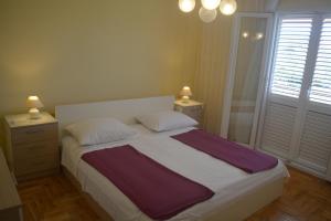 Posteľ alebo postele v izbe v ubytovaní Marin Apartment