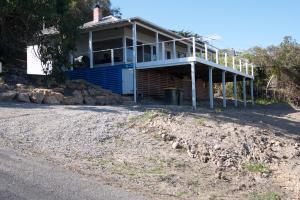 a house sitting on the side of a road at Loutit Views in Lorne