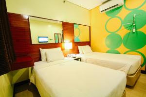 Postel nebo postele na pokoji v ubytování Go Hotels Tacloban + 14 fotografií