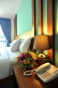 Ein Bett oder Betten in einem Zimmer der Unterkunft Baan Karon Resort