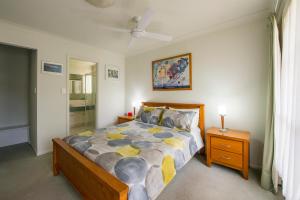 a bedroom with a large bed in a room at Bellevue Bed & Breakfast in McLaren Vale