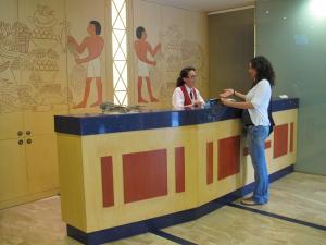 two women standing at a counter in a room at Cleopatra Spa Hotel in Lloret de Mar