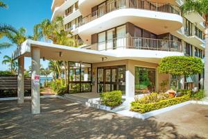 a large building with a lot of windows at Broadwater Shores Waterfront Apartments in Gold Coast