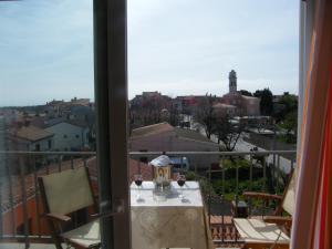 a view of a balcony with a table and chairs at Apartment Mamut in Premantura