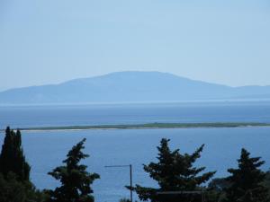an island in the middle of a large body of water at Apartment Mamut in Premantura