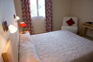 Postel nebo postele na pokoji v ubytování Hotel Cesario