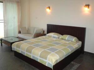 سرير أو أسرّة في غرفة في View Talay 5C
