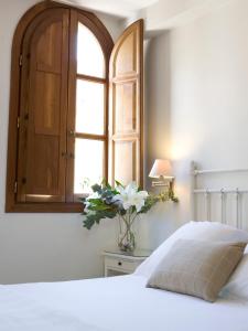 A bed or beds in a room at Palacio De Los Navas