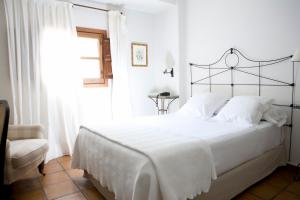 Säng eller sängar i ett rum på Palacio De Los Navas