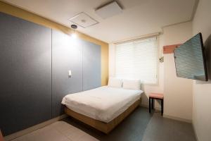 Postel nebo postele na pokoji v ubytování Champion Hotel