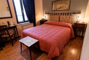 Postel nebo postele na pokoji v ubytování Hotel Relais Valle Orientina