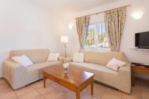 a living room with two couches and a coffee table at Monte Blanco in Jávea