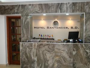 a sign for a hotel batukongerateerateerate sidx sidx sidx sidx at Hotel Santander SD in Santo Domingo