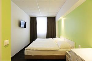 Postel nebo postele na pokoji v ubytování Business & City