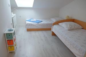 Postel nebo postele na pokoji v ubytování Apartment Dubravka