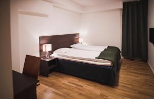 Säng eller sängar i ett rum på Stay Xtra Hotel Kista