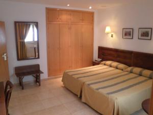 Postel nebo postele na pokoji v ubytování Hotel Tio Felipe