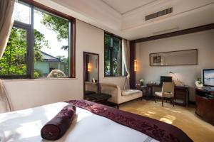 TV a/nebo společenská místnost v ubytování Zhejiang Xizi Hotel