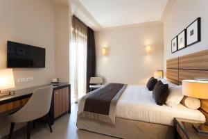 Voodi või voodid majutusasutuse Hotel Ambasciatori toas