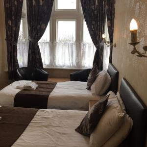 Postel nebo postele na pokoji v ubytování Woodthorpe Hotel