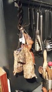a piece of paper hanging on a wall with utensils at Corsica Monti Gite Appart in Petreto-Bicchisano