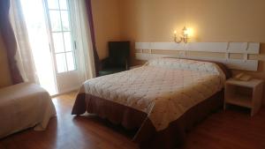 Postel nebo postele na pokoji v ubytování Hotel El Molino