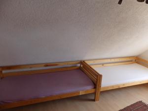 a wooden bunk bed in a room at Wohnung Kronacher in Stadtsteinach