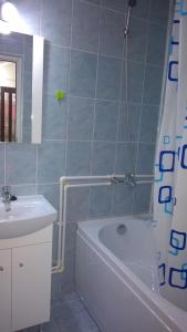 a bathroom with a tub and a sink and a shower at Vila MariCris in Tuzla +76 photos