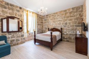 Un pat sau paturi într-o cameră la Pietra Rossa
