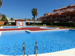 a large swimming pool in front of a building at Jardines de Denia IV El Conserje in Denia