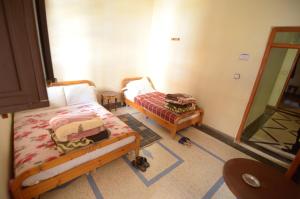Voodi või voodid majutusasutuse Hotel Imilchil toas