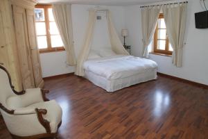 Postel nebo postele na pokoji v ubytování Auberge du Rempart