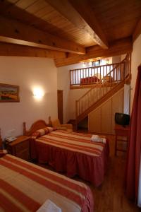 Postel nebo postele na pokoji v ubytování Hotel Can Mestre