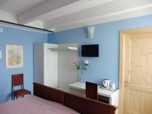 TV a/nebo společenská místnost v ubytování Affittacamere Porticciolo