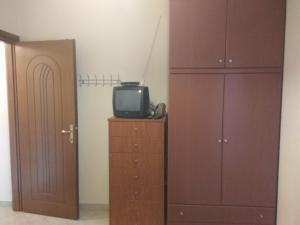 TV a/nebo společenská místnost v ubytování Ioannis Stagkonis Apartment