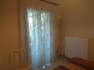 Postel nebo postele na pokoji v ubytování Ioannis Stagkonis Apartment