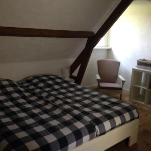 Een bed of bedden in een kamer bij Dijkhuis Breskens