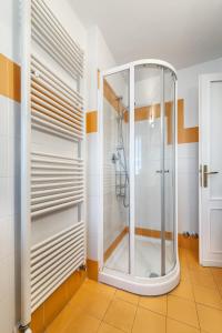 a bathroom with a shower with a glass door at Lucca in Villa San Marco in Lucca