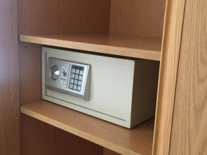 a microwave on a shelf in a cabinet at Hostal Carracedo in Madrid +45 photos