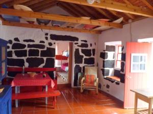 a toy house with a room with a fake cow wall at Casa da Lagoa AL 416 in Fajã da Caldeira de Santo Cristo