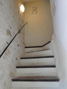 a set of stairs in an old building at Appartement La Tourraque côté mer in Antibes