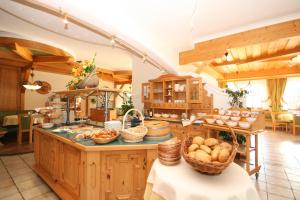 a kitchen with a counter with baskets of food on it at Alpenhotel Neuwirt in Schladming